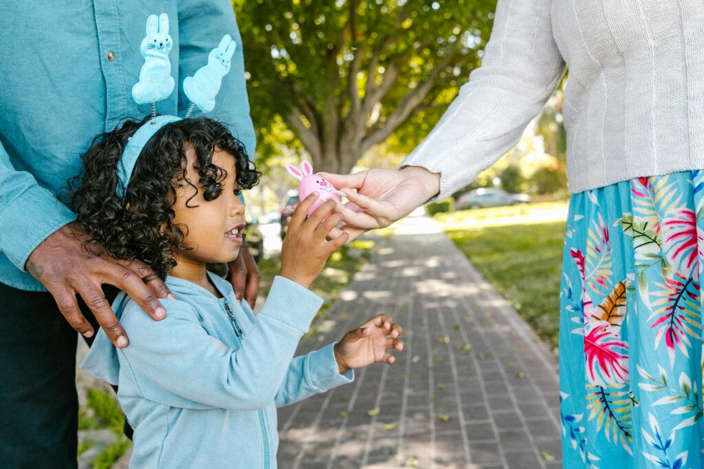 A Girl Receiving an Easter Egg
