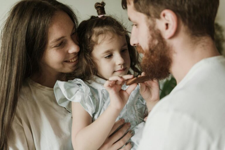 Close-up of a joyful family moment with parents and child indoors. Love and bonding.