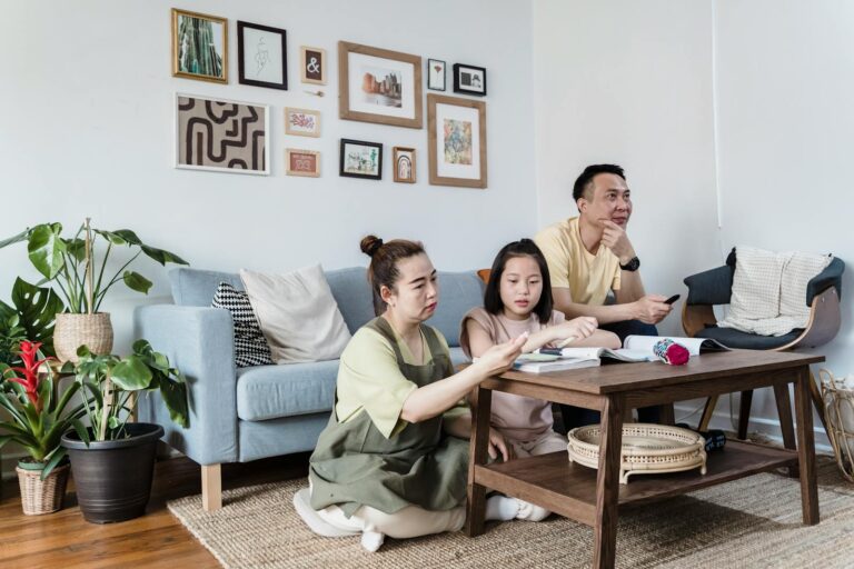 A family enjoying quality time at home in a cozy and stylish living room setting.