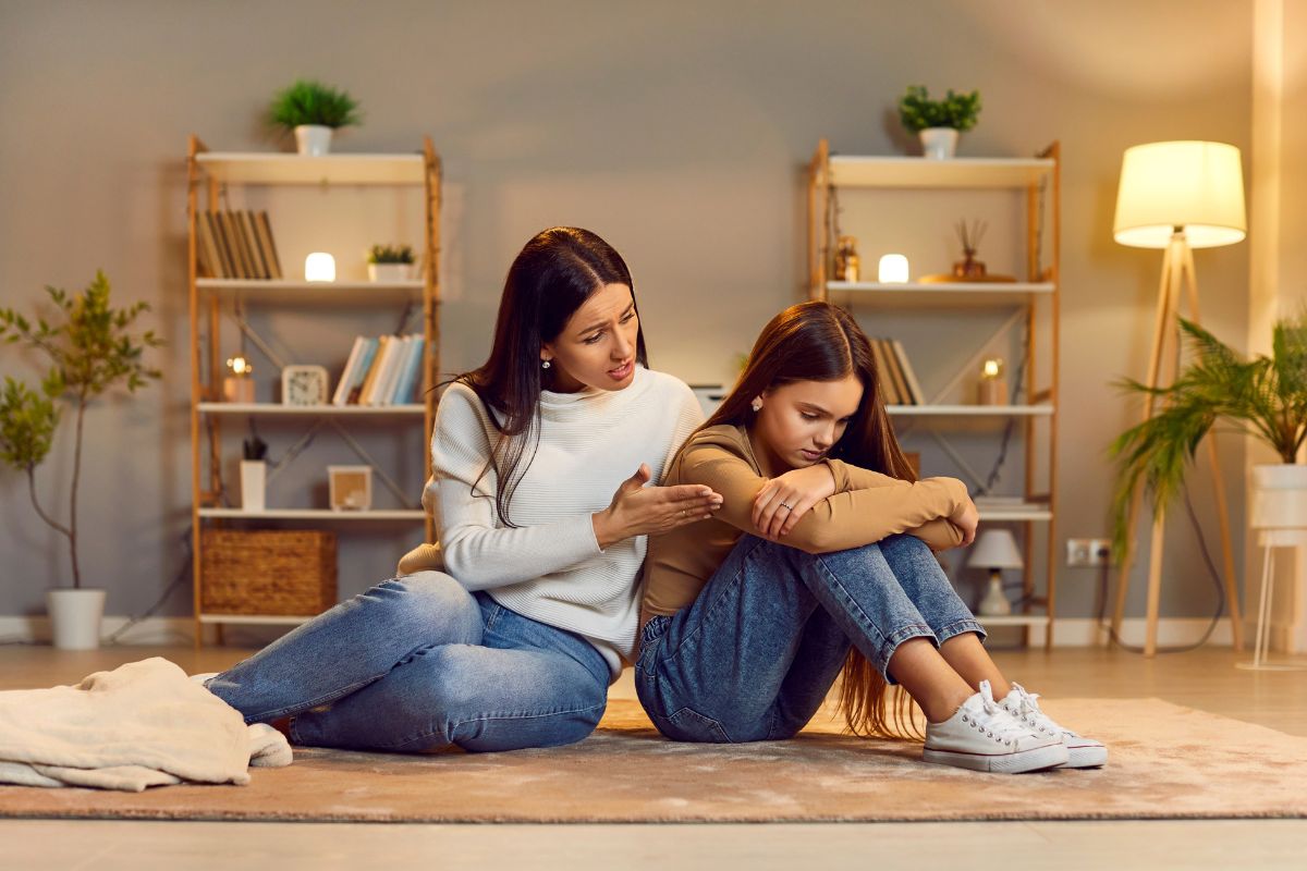 Mom and daughter talking, upset.