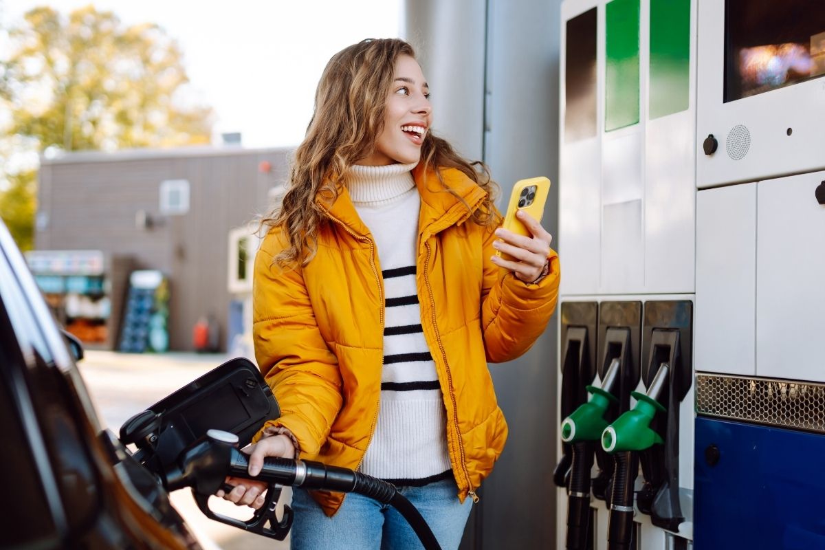 Woman pumping gas