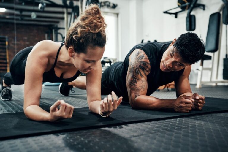 man and woman doing a plank