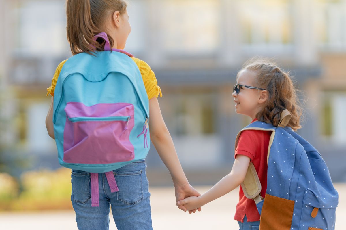 two girl holding hands