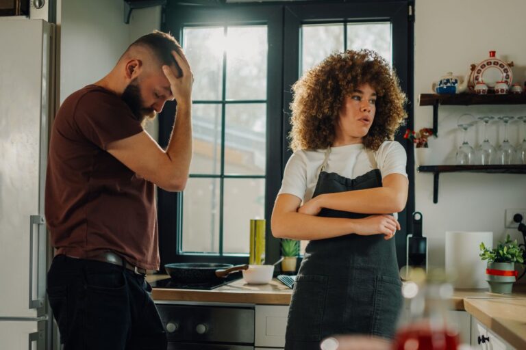 two people man and woman looking annoyed with another