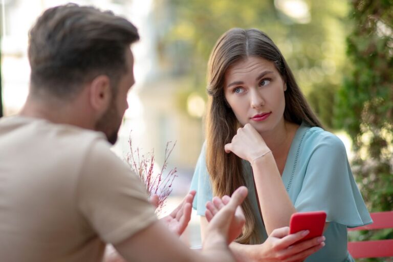woman on a date looking unhappy