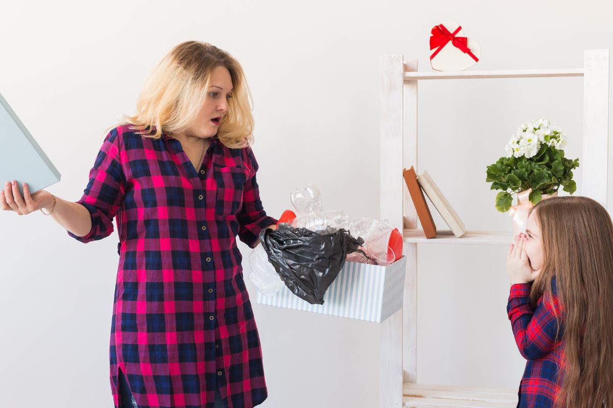 Mom holding a box full of garbage