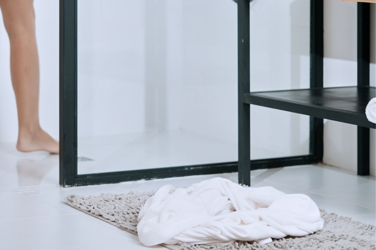 bath mat and towel on the floor