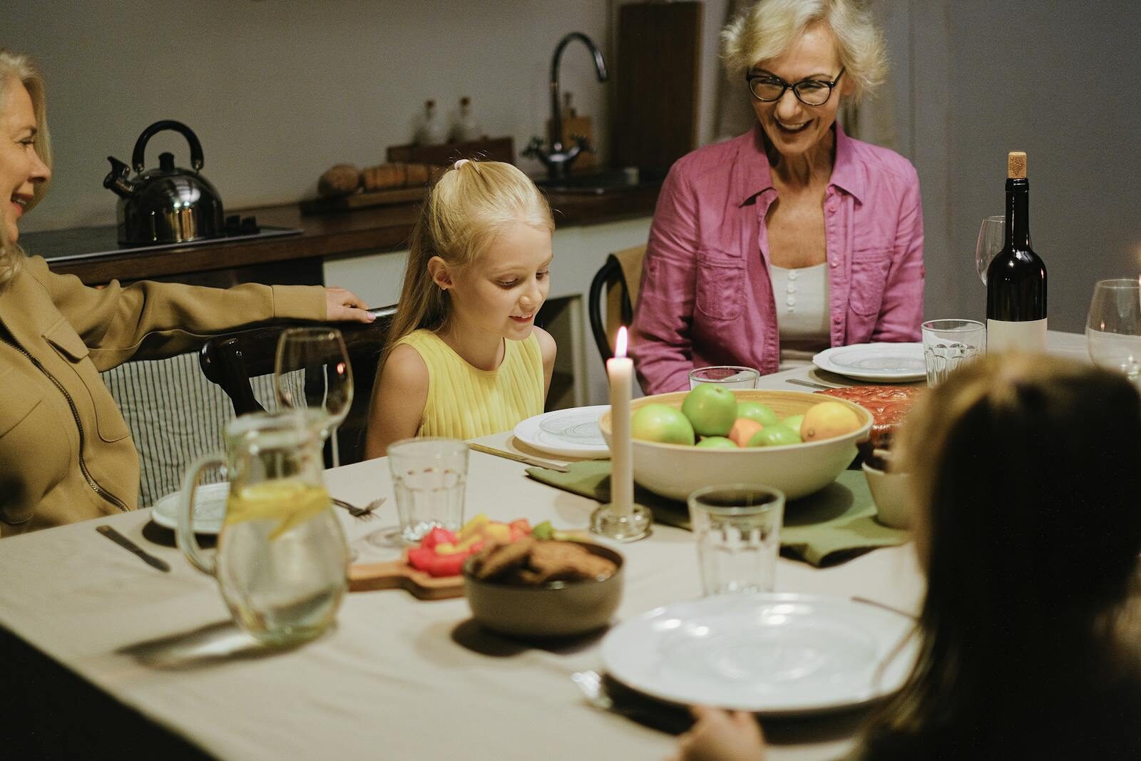 Family enjoying a cozy dinner together, showcasing warmth and togetherness.