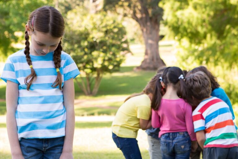 Girl excluded from her friends looking sad
