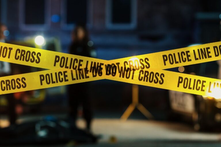 Police tape in a cross