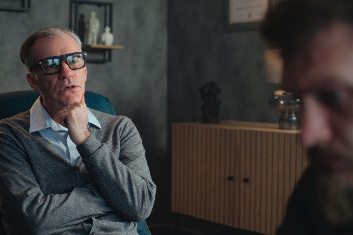 Therapist and blurry image of a patient