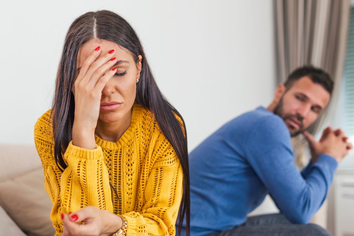 Woman upset husband behind her