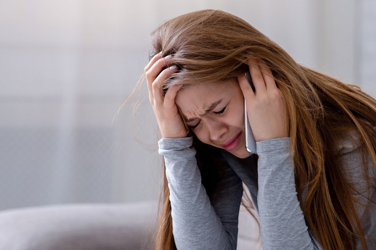 Young woman on the phone looking upset