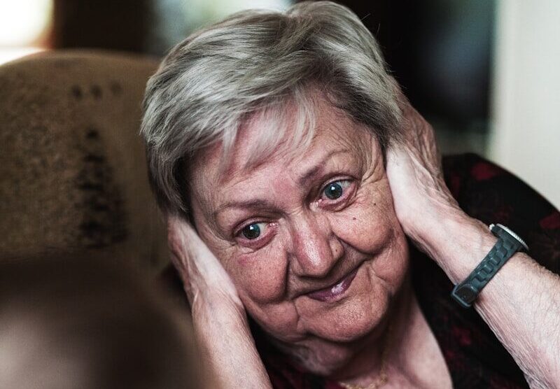 woman covering her ears photo
