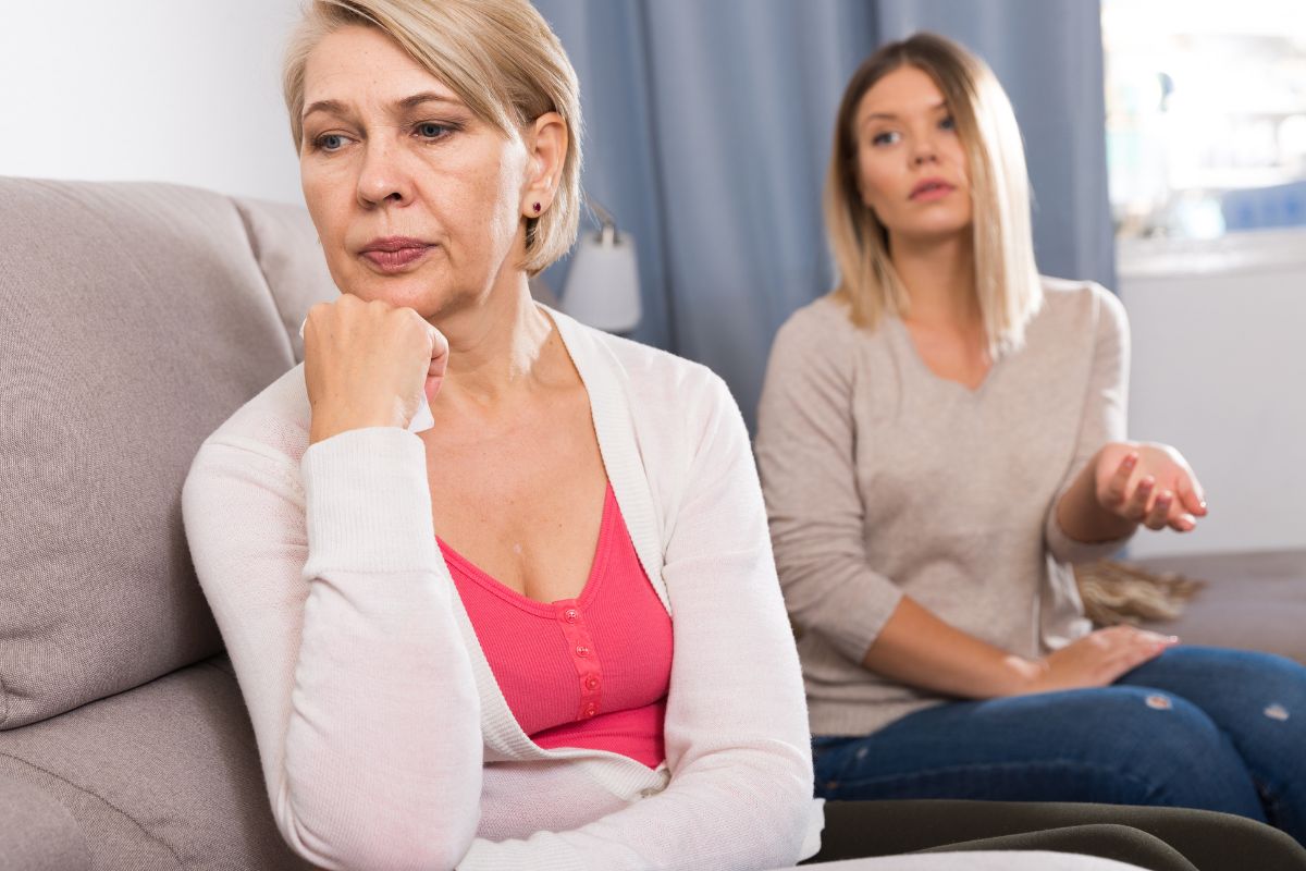 woman and mom arguing, looking upset
