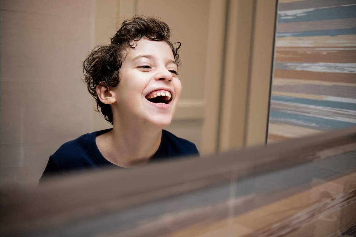 A Dad Found Out His Son Had Been Practicing a Different Laugh in the Mirror Because He Thought His Real One Sounded "Too Much"