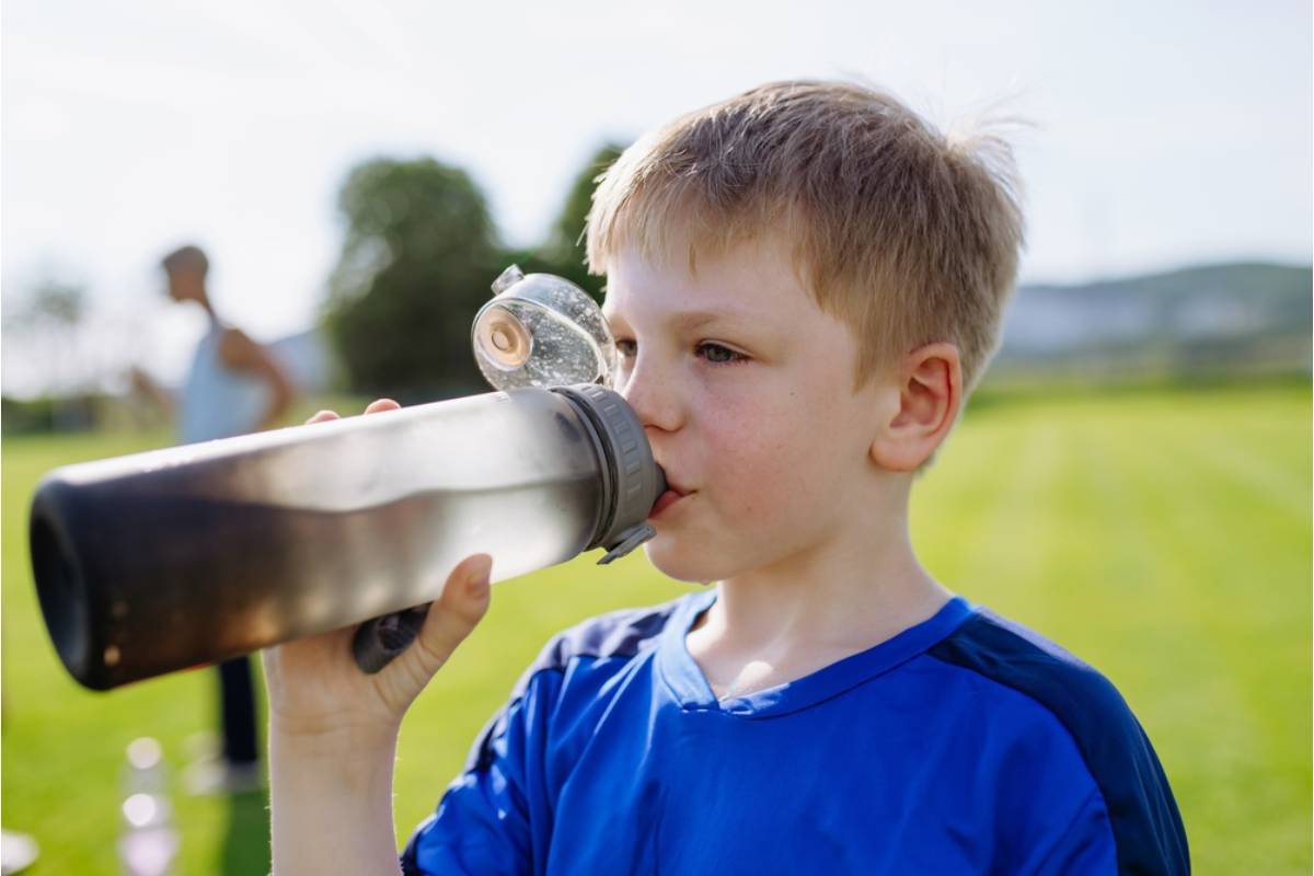 A Mom Says Her Son's Coach Noticed He Never Asked for Water Breaks Even When Everyone Else Did, and Started Handing Him a Bottle Without Asking