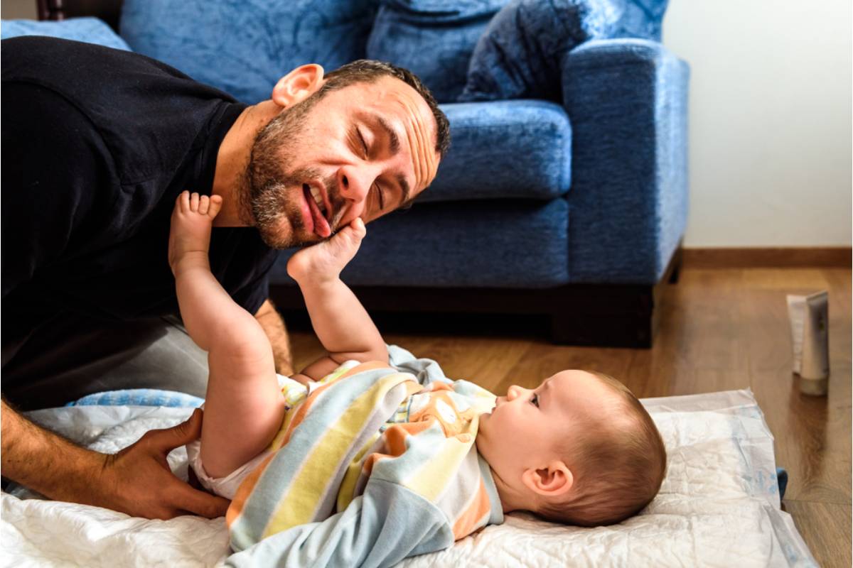 A Dad Says Dressing His Eight-Month-Old Daughter Suddenly Felt Like Wrestling an Octopus, and the Tiny Buttons Were Only Making Things Worse