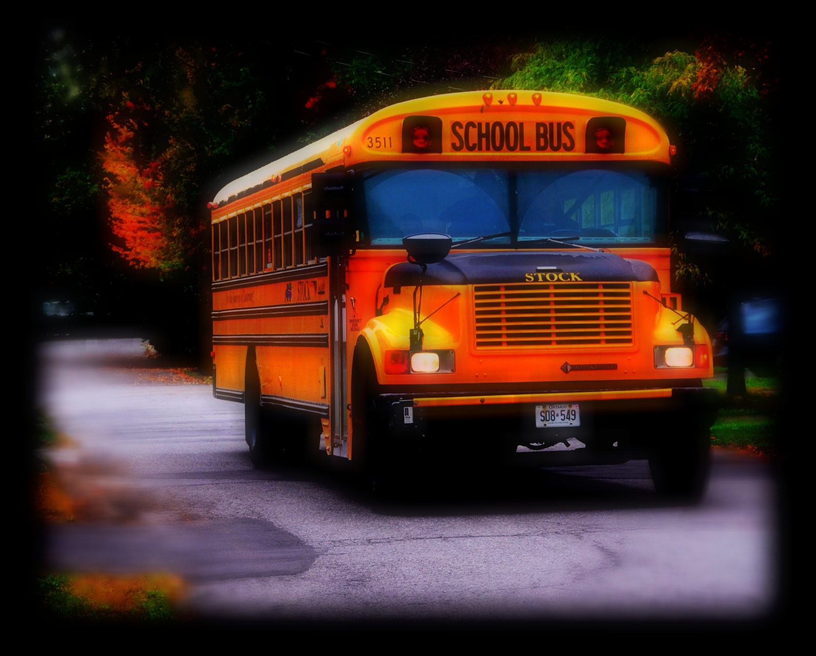 A yellow school bus parked on a street