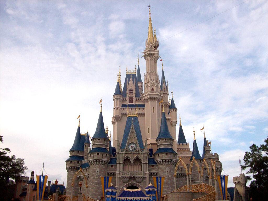 Cinderella Castle at Walt Disney World's Magic Kingdom under a blue sky