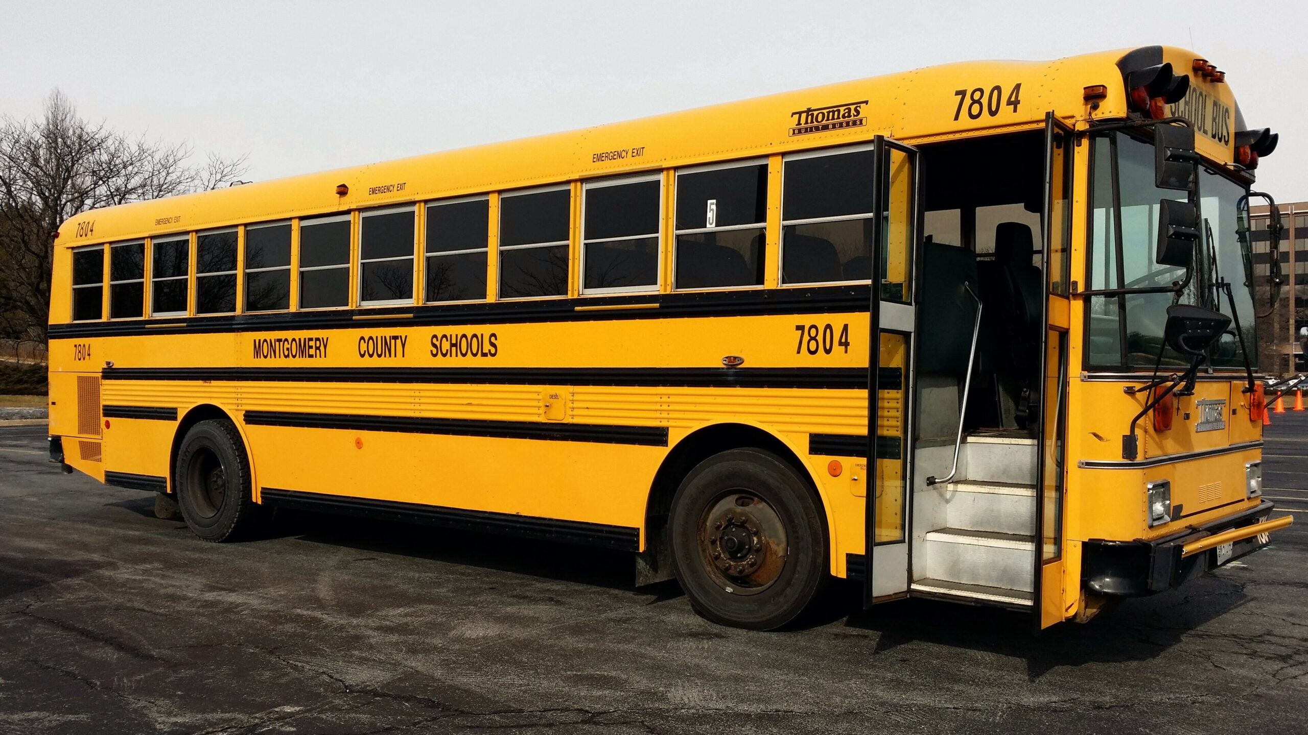 Side view of a yellow school bus