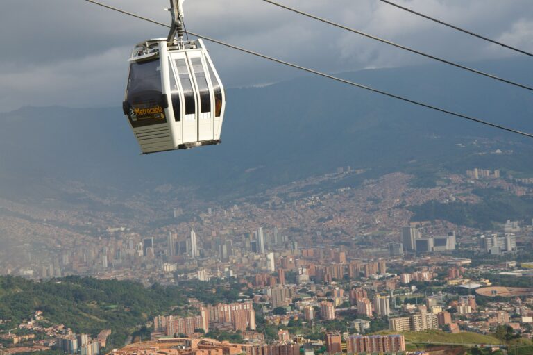 A Metrocable cabin passing high above the hillside neighborhoods of Medellín, Colombia