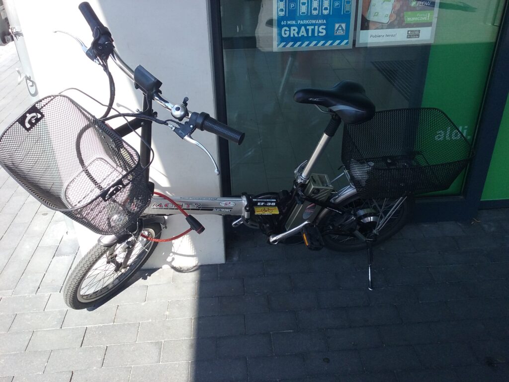 An electric bicycle parked on a city sidewalk