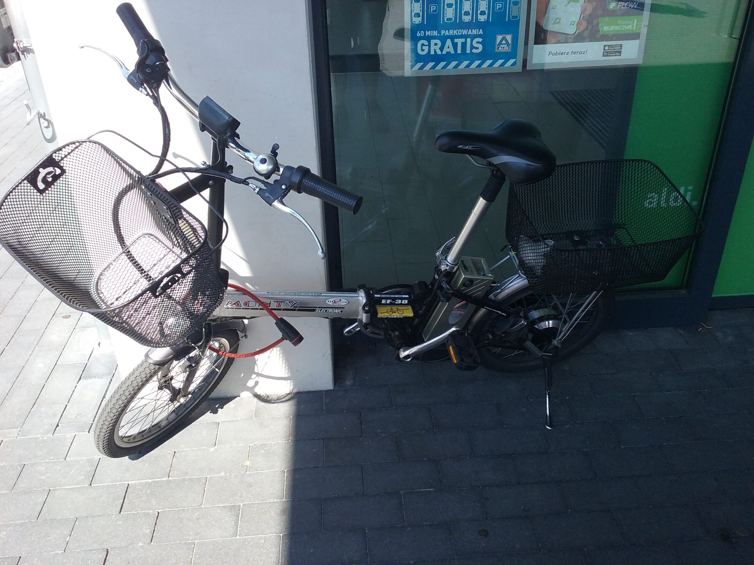 An electric bicycle parked on a city sidewalk